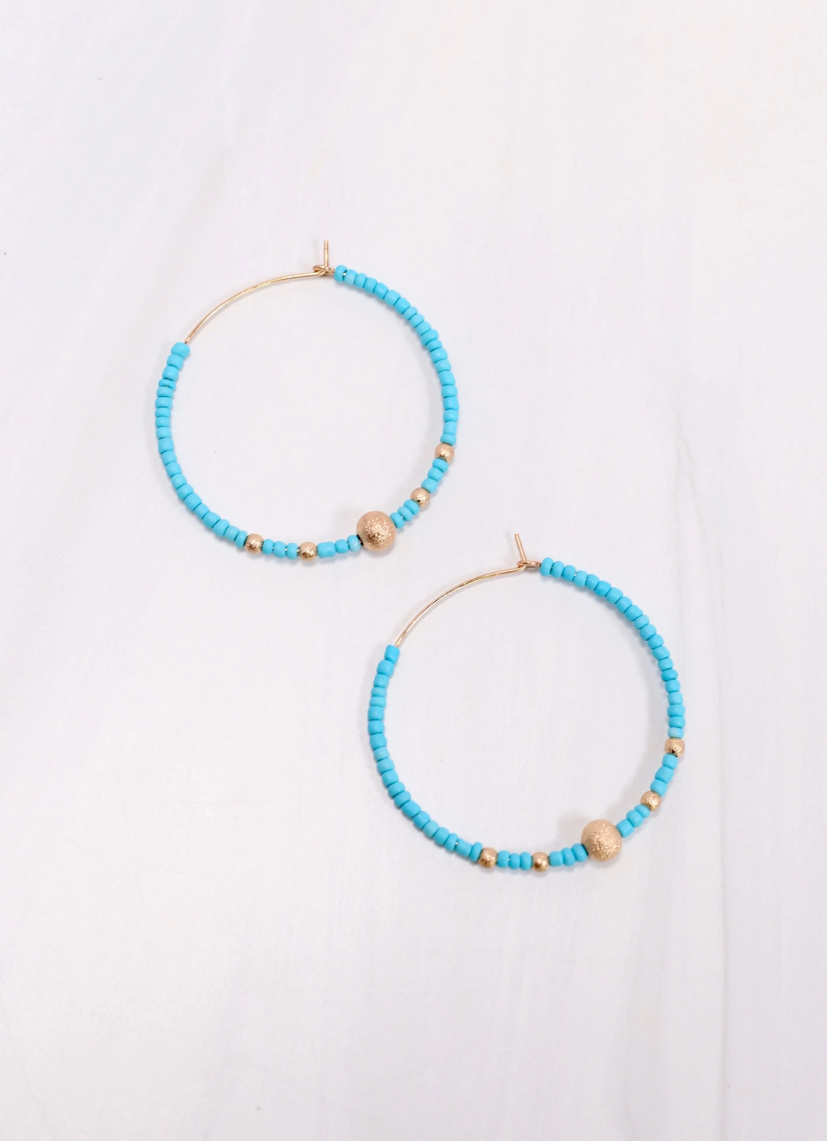 TURQUOISE Beaded Hoop Earrings by Maranda